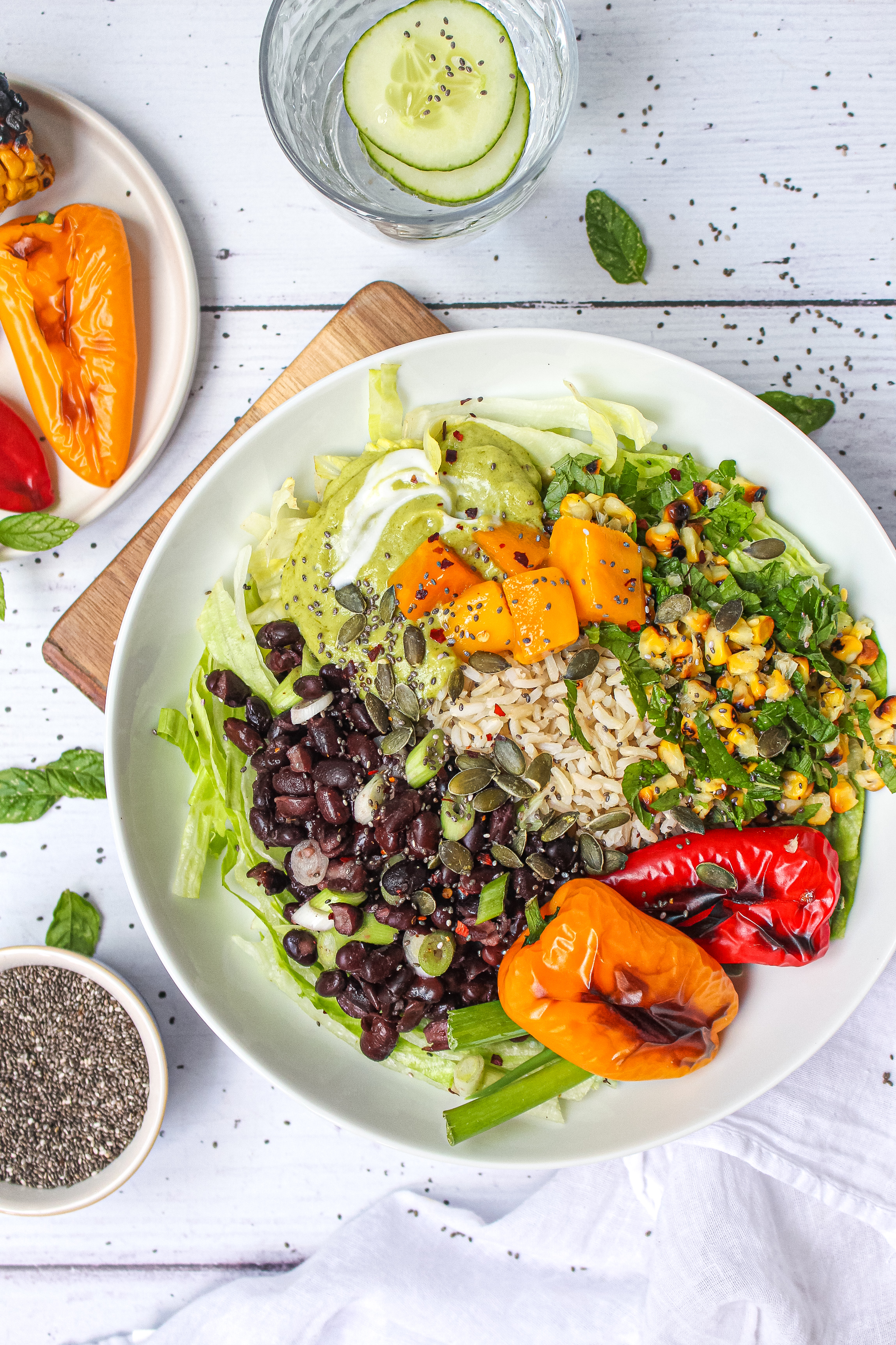 Charred Red Pepper Corn and Black Bean Bowl with Avocado Crème