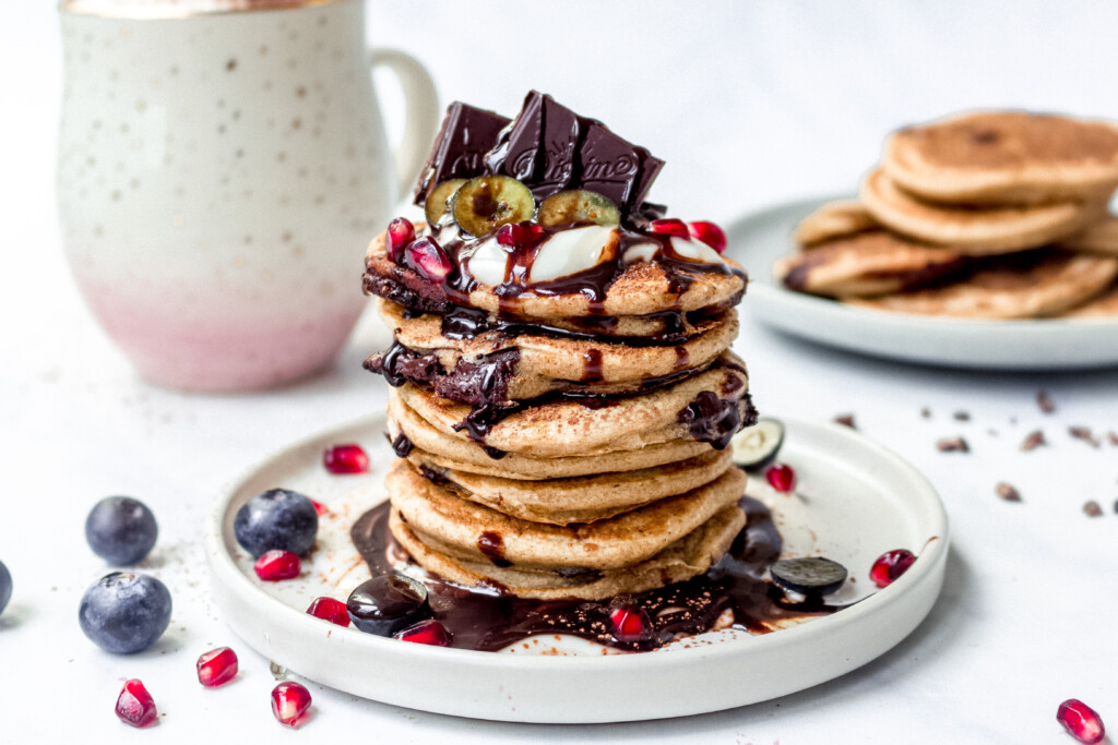 https://nourishingamy.com/wp-content/uploads/2020/01/chocolate-chunk-pancakes-4.1-1024x683.jpg