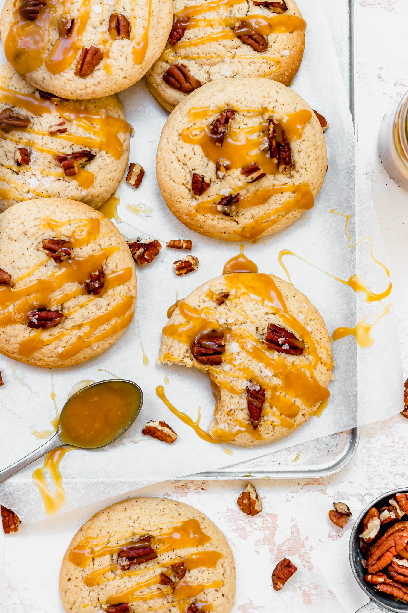 Chai Pecan Caramel Stuffed Cookies with a spoon of caramel