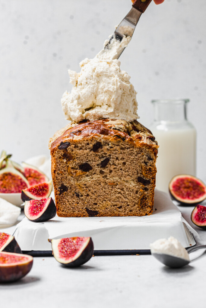 Spreading frosting on Tahini Fig and Chocolate Banana Bread