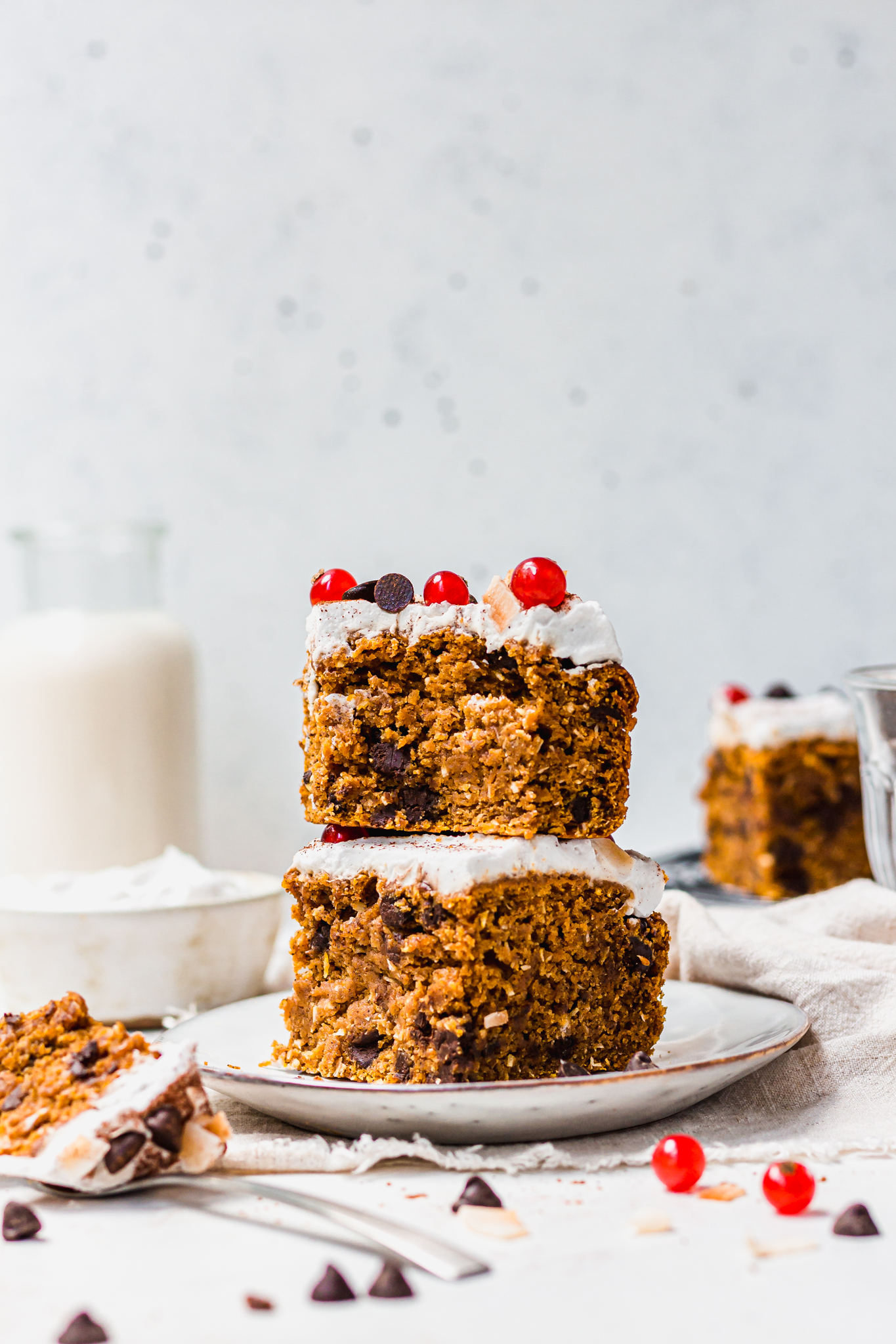 A stack of 2 pieces of Pumpkin Chocolate Chip and Coconut Cake