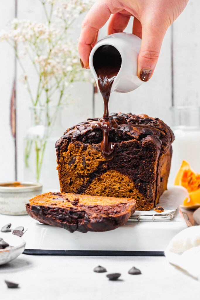 Chocolate Pumpkin Swirl Bread with chocolate pouring