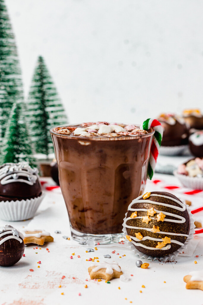 Easy Vegan Hot Chocolate Bomb in front of a glass of hot chocolate
