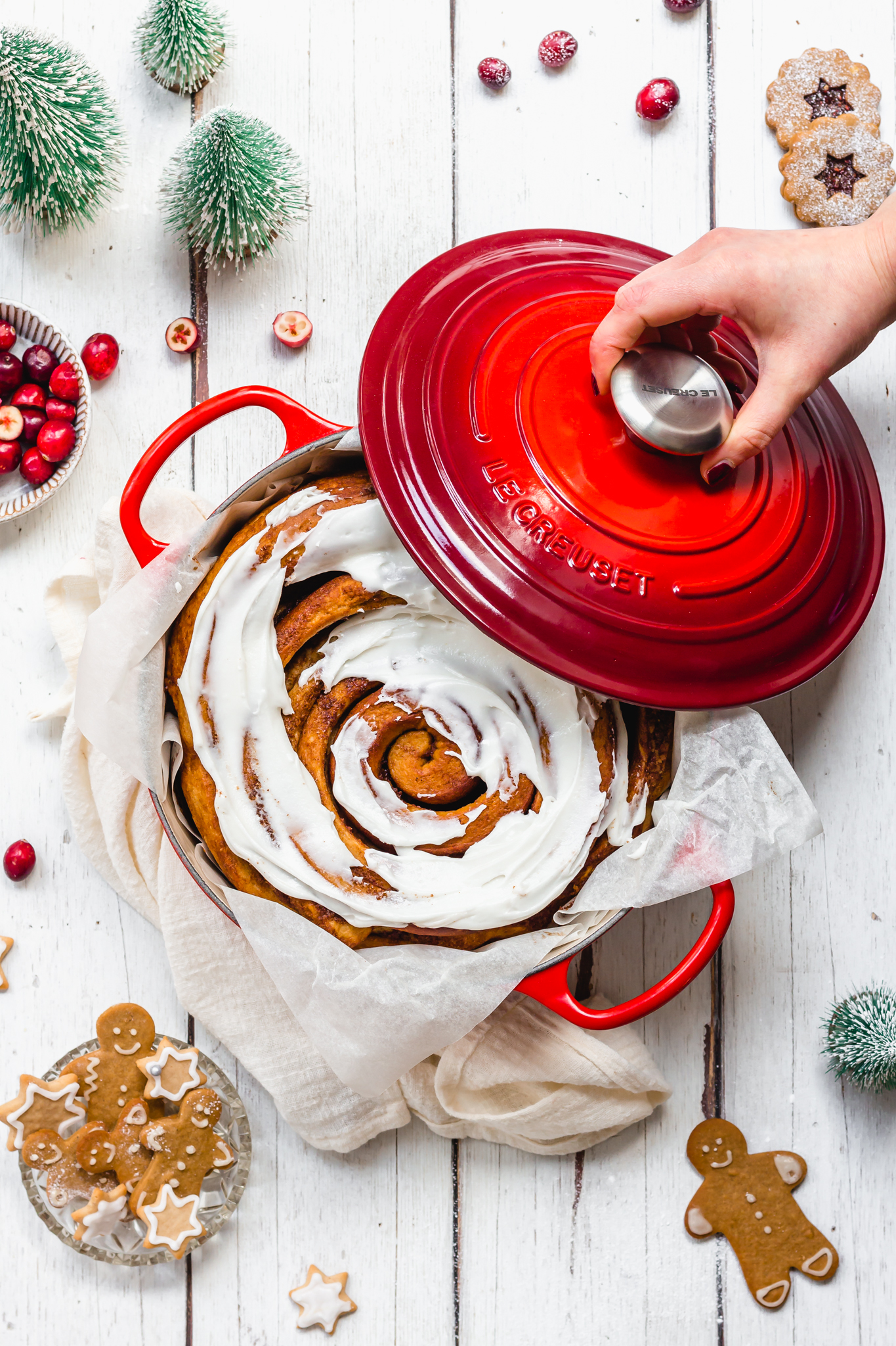 Giant Gingerbread Cinnamon Roll in a red casserole dish
