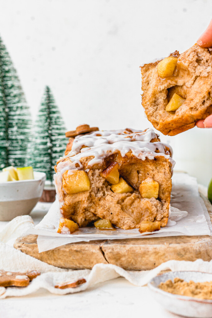 Pulling apart a slice of Gingerbread Apple Pull Apart Bread