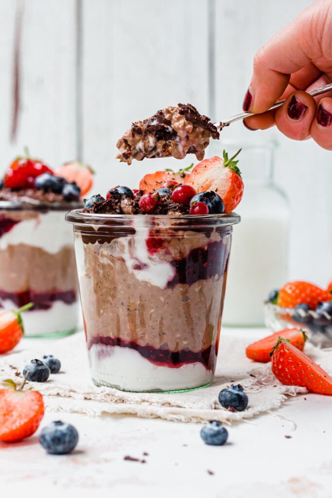 Taking a spoonful of Chocolate Berry Overnight Oats