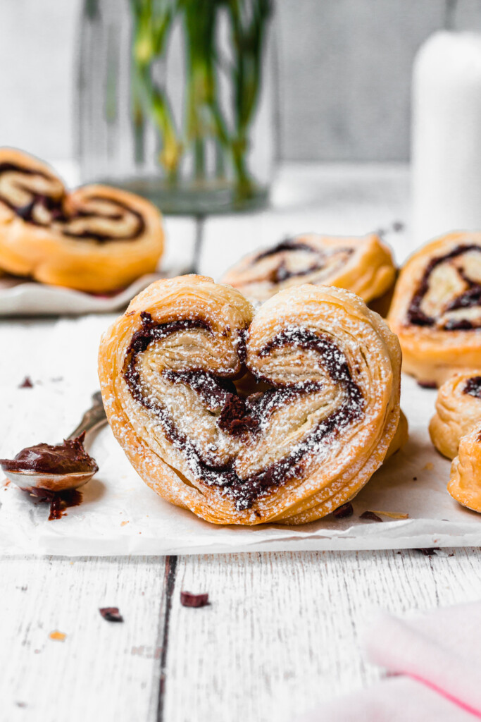 Chocolate Puff Pastry Hearts on a wooden backdrop