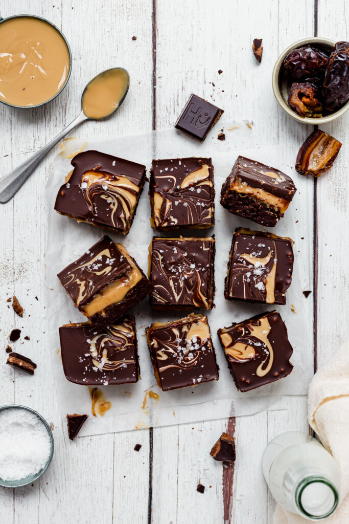 No Bake Almond Caramel Brownies on a wooden board