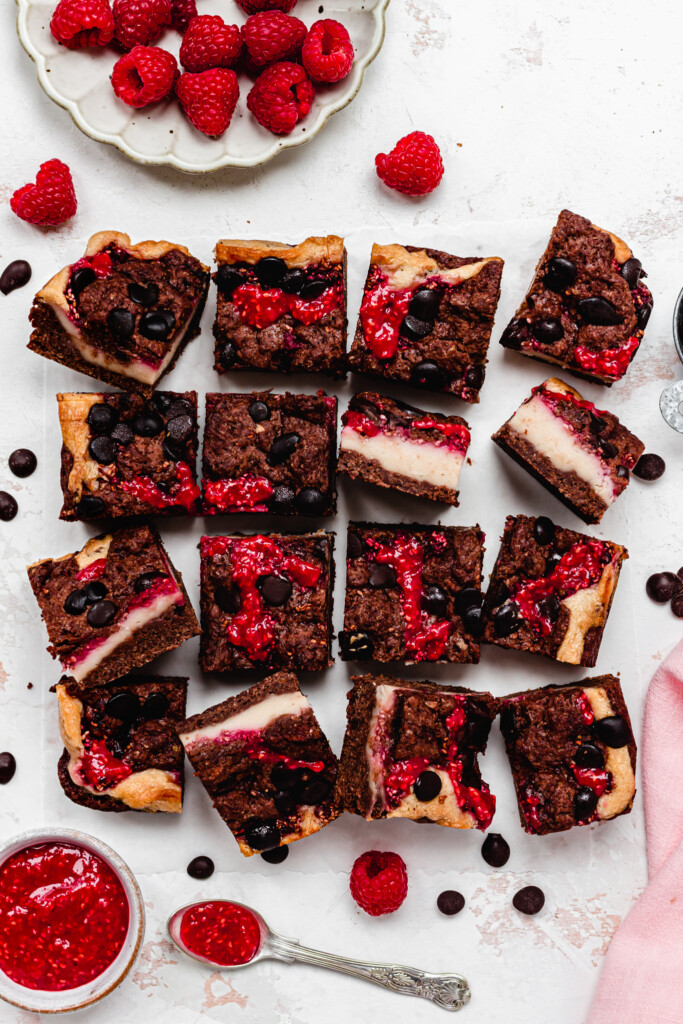 Chocolate Raspberry Cheesecake Brownies on a white board