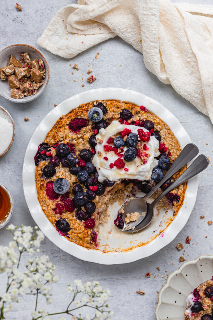 Two spoons in a dish of Chocolate Berry Baked Oats