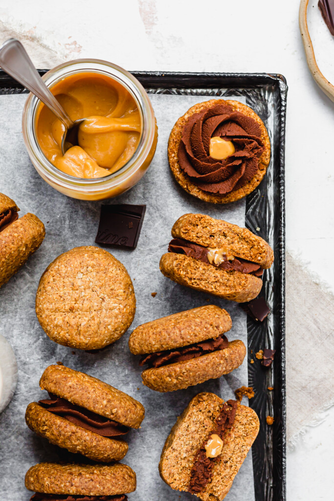 A close up of Chocolate Filled Peanut Butter Cookie Sandwiches on a metal tray