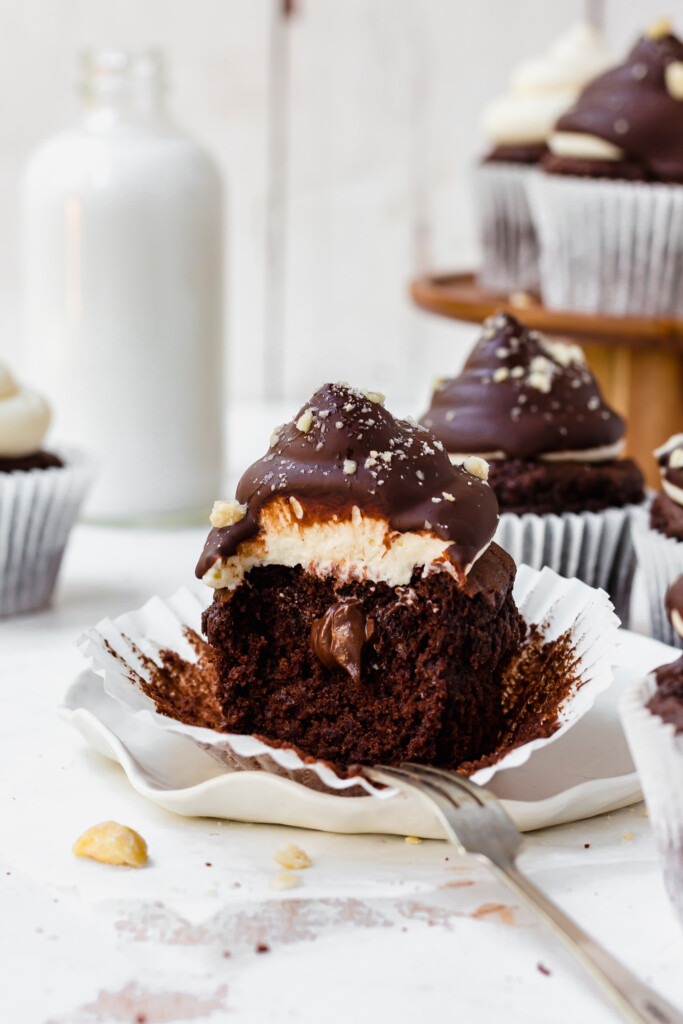 Chocolate Hazelnut Dipped Cupcake on a plate with a fork
