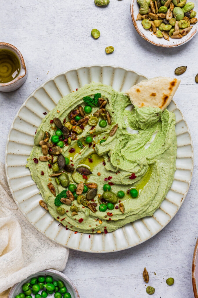 A bowl of Minty Pea Hummus and flatbread