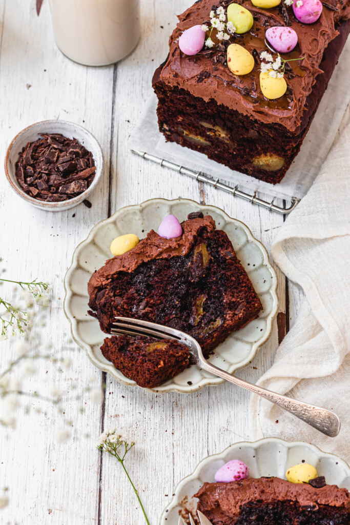 A slice of Vegan Double Chocolate Fig Loaf Cake on a small plate