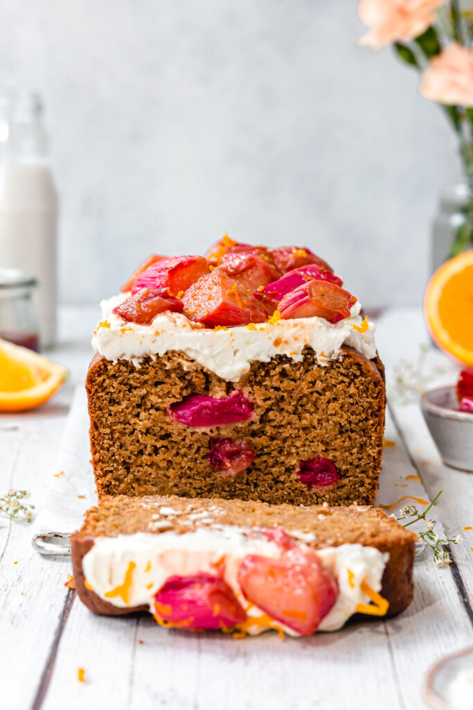 Orange and Rhubarb Loaf Cake with a slice cut out