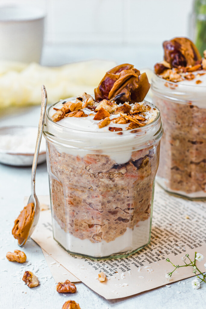 Vegan Carrot Cake Overnight Oats with a spoon leaning against the jar