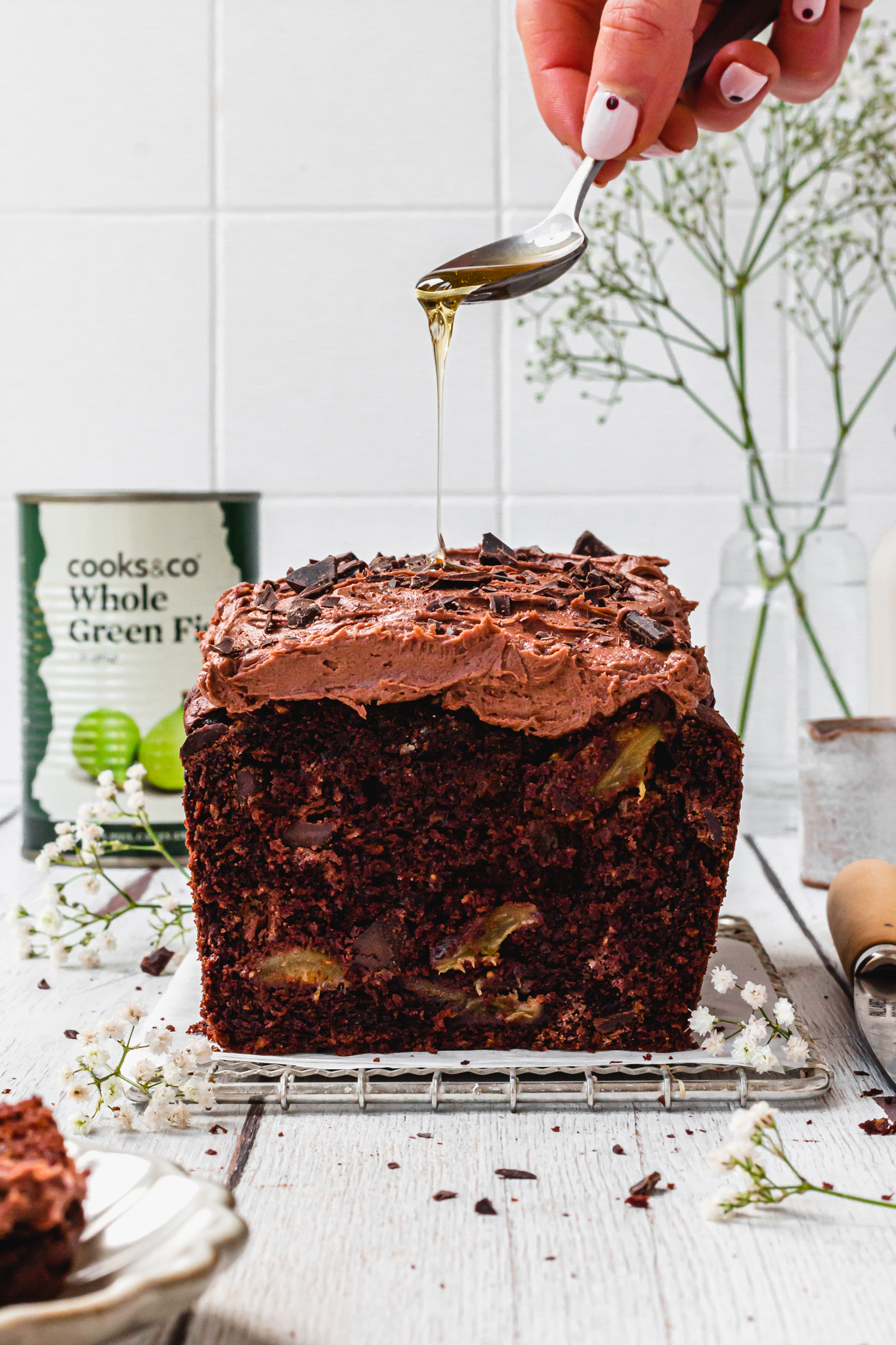 Vegan Double Chocolate Fig Loaf Cake with a tin of green figsq