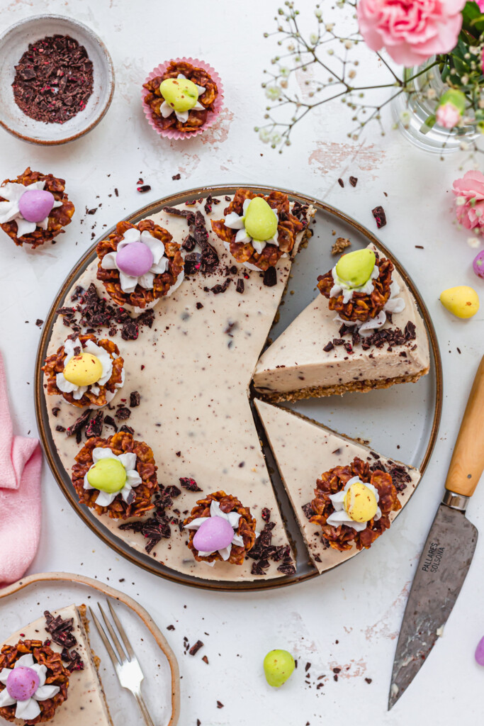 Two slices cut out of a Vegan Easter Cheesecake