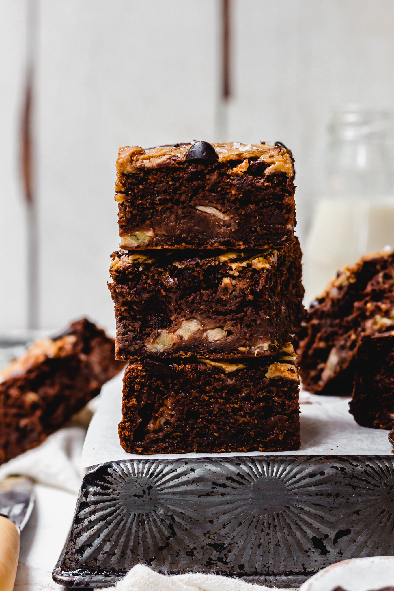 A stack of three Chocolate Banana Bread Peanut Butter Brownies
