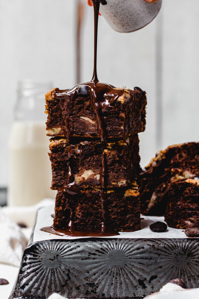 Drizzling chocolate over Chocolate Banana Bread Peanut Butter Brownies