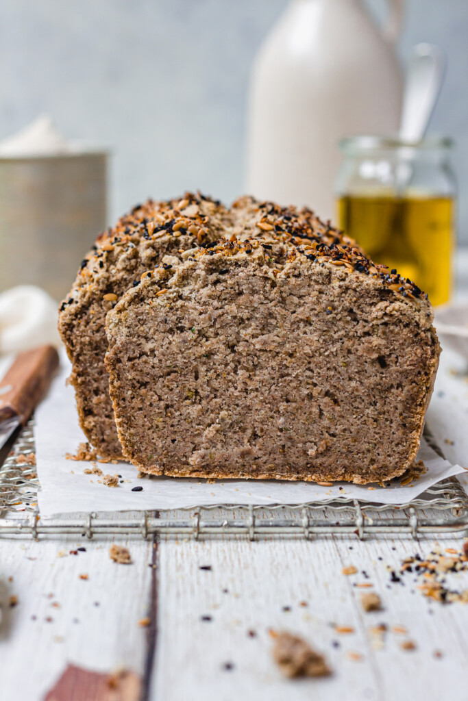 A loaf of Gluten-Free Vegan Buckwheat Bread on a wire rack