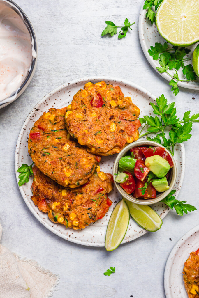 Three Sweetcorn Red Pepper Fritters on a plate