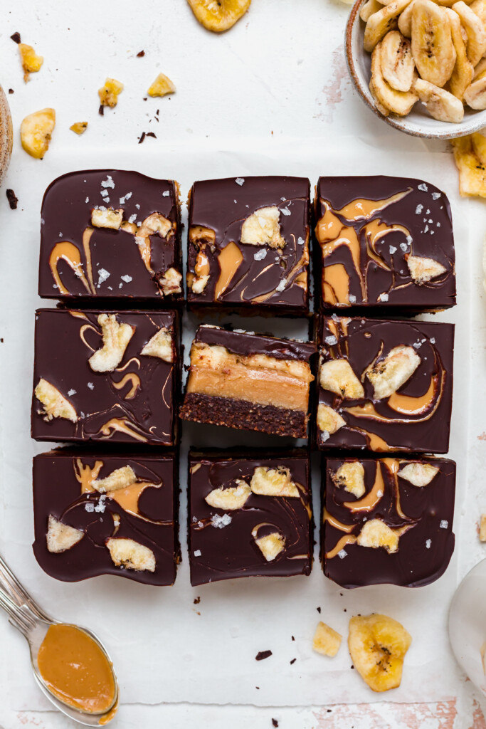 9 Chocolate Peanut Butter Banana Caramel Squares with one on its side