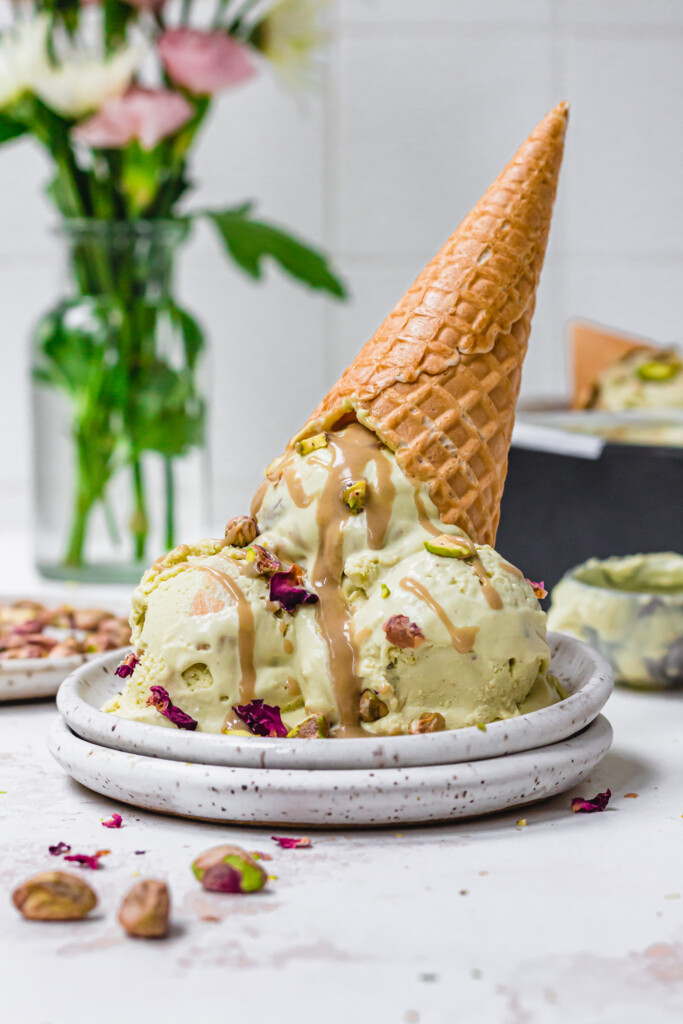An upturned cone of Tahini Pistachio Ice Cream
