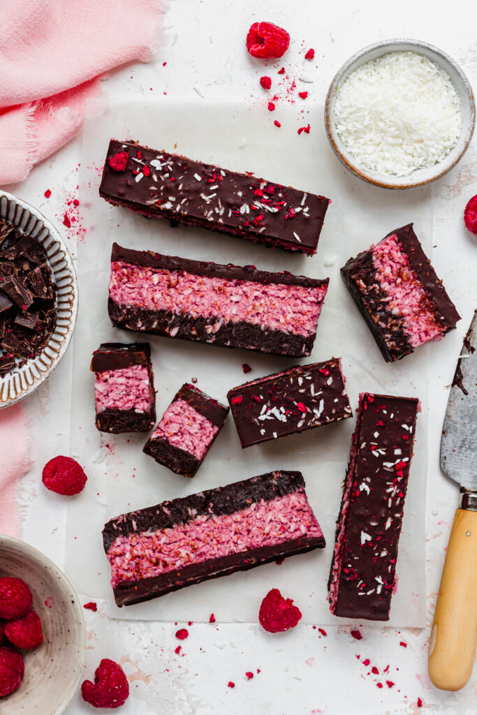 Chocolate Raspberry Coconut Slices with a pink linen