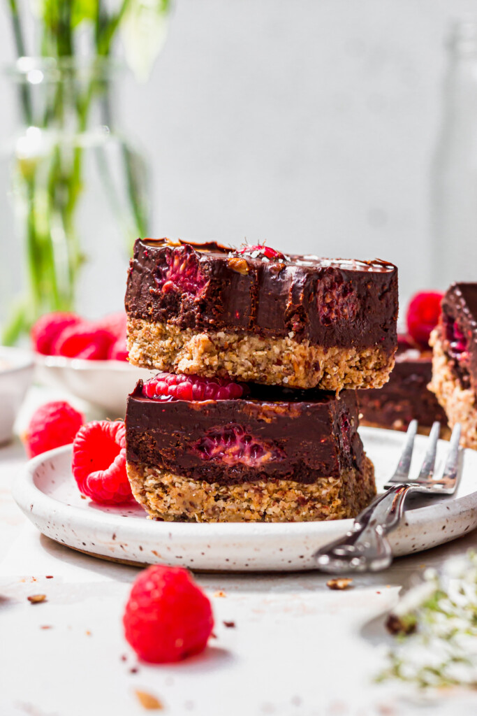 Two Chocolate Raspberry Fudge Bars on a small plate