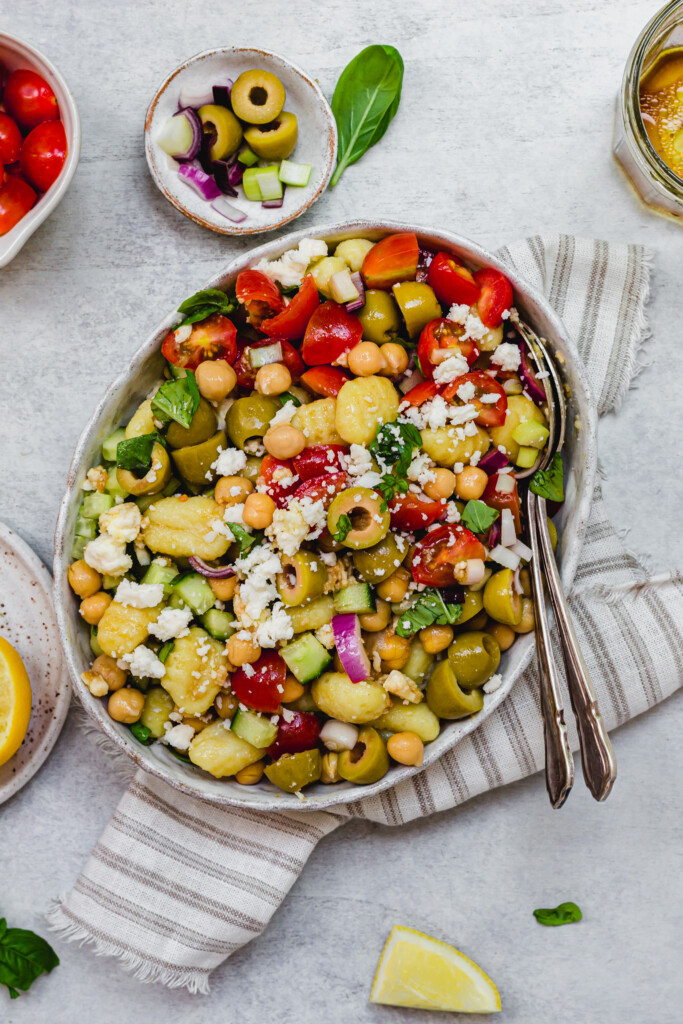 Gnocchi Chickpea and Feta Salad tossed together with two spoons