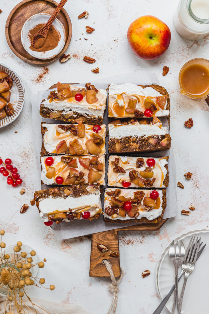 8 Caramel Apple and Pecan Blondies on a wooden board