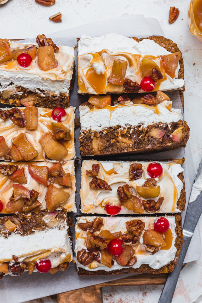 8 bars of Caramel Apple and Pecan Blondies on a wooden board