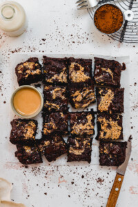 Chocolate Courgette Fudge Brownies on a board cut into 16