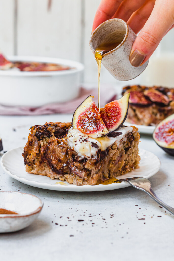 Pouring syrup over a piece of Chocolate and Fig Baked Oats