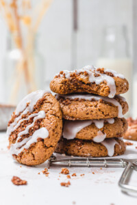 A stack of three Cinnamon Streusel Cookies with one leaning on the side