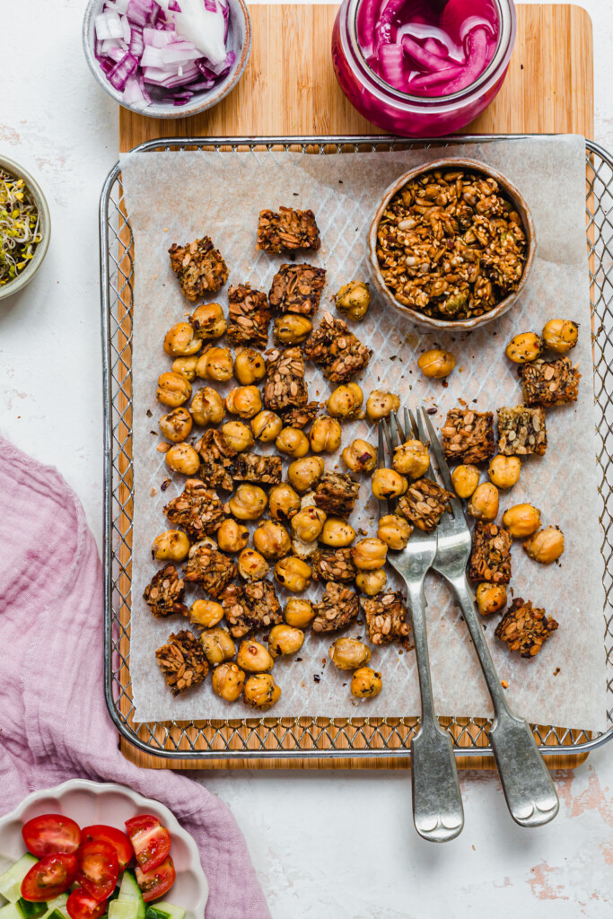 Crunchy chickpeas and bread croutons on a wire rack