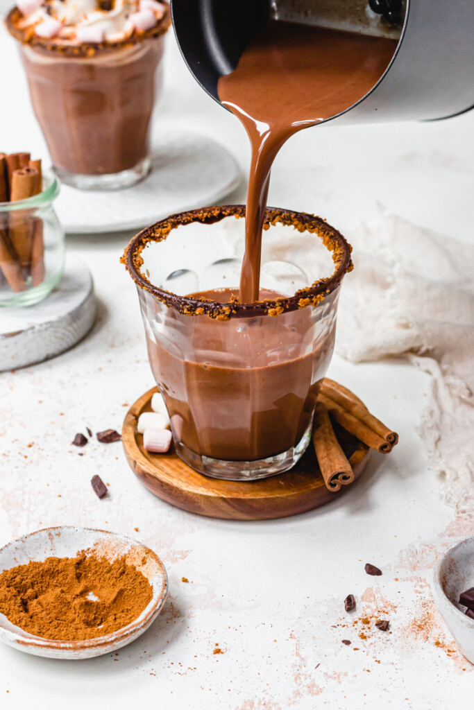 Pouring Pumpkin Spice Hot Chocolate into a glass from the Chocolatier