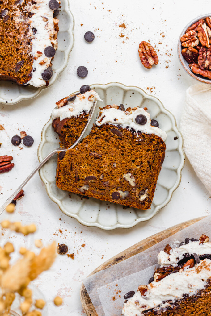 A fork and slice of Chocolate Chip Chai Pumpkin Loaf on a plate