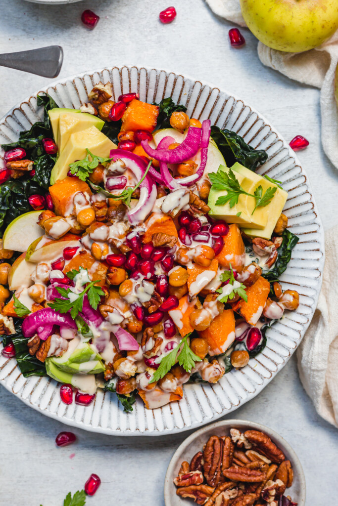 A close up of Ginger Roasted Squash and Chickpea Salad with Tahini