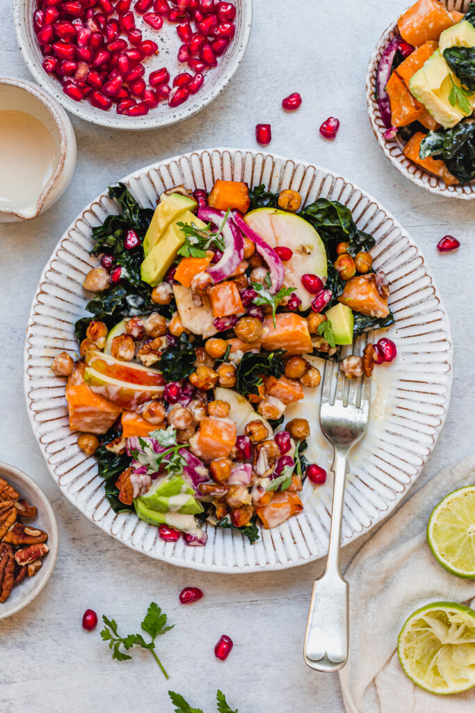Half eaten bowl of Ginger Roasted Squash and Chickpea Salad with Tahini