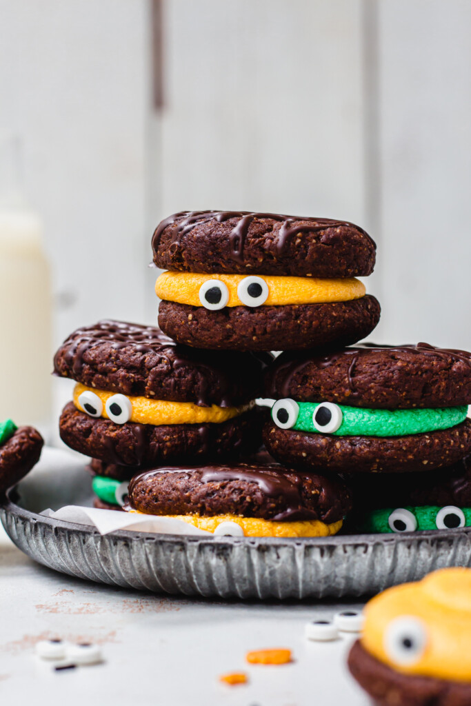 A stack of Halloween Chocolate Oreo Cookies in a grey dish