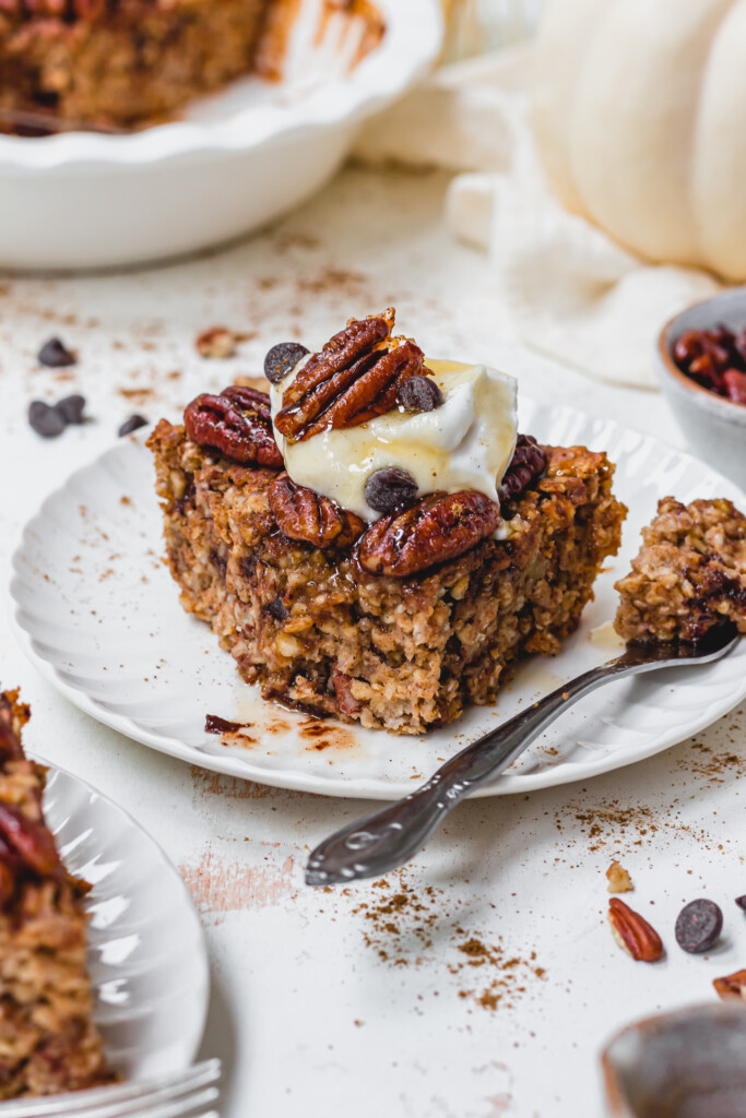 A slice of Pecan Pie Chocolate Chip Baked Oats with a fork