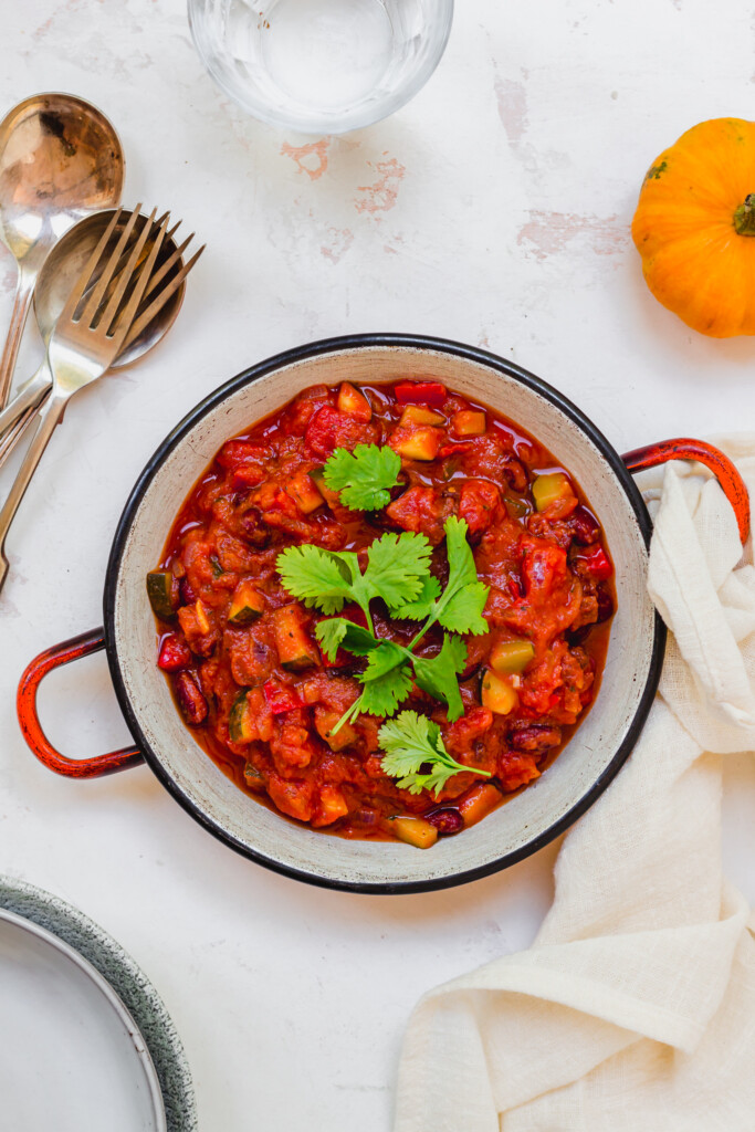 A red dish of Pumpkin and Kidney Bean Chilli