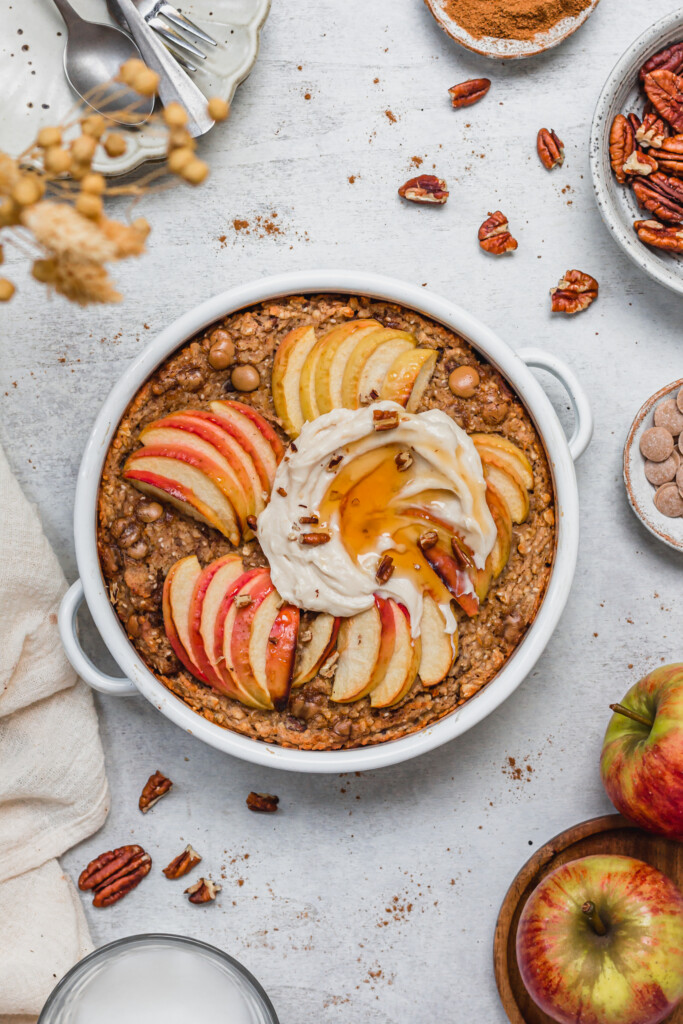 Toffee Apple Pecan Baked Oats with yoghurt and syrup on top