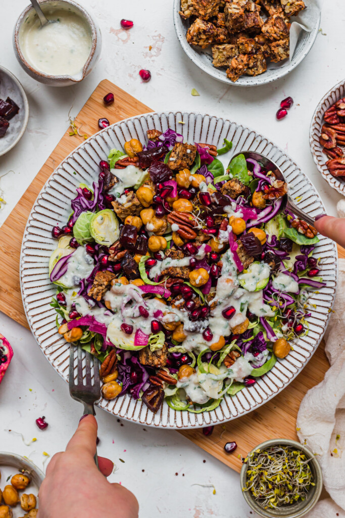 Tossing together a Brussel Sprout Red Cabbage Slaw with Crunchy Chickpeas
