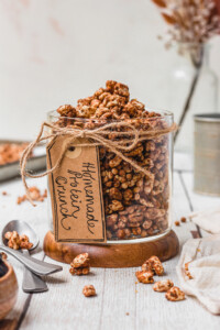 A glass jar full of Homemade Protein Crunch Cereal