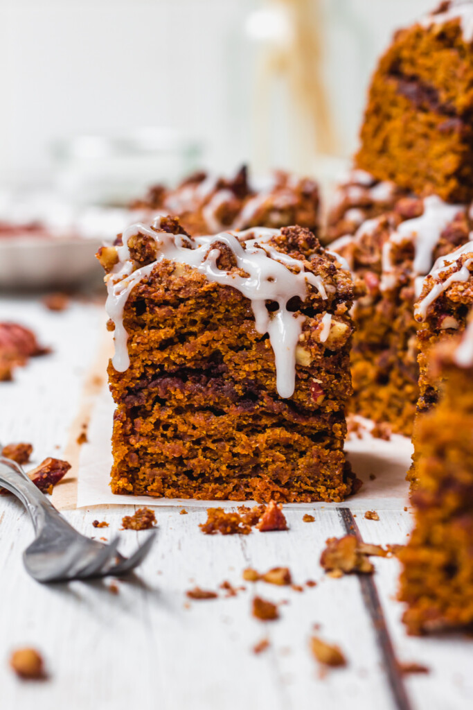 One square of Sweet Potato Cinnamon Streusel Coffee Cake with icing sugar drizzle