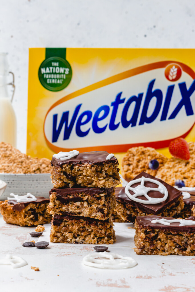 Three Chocolate Chip Weetabix Flapjack in front of a cereal box