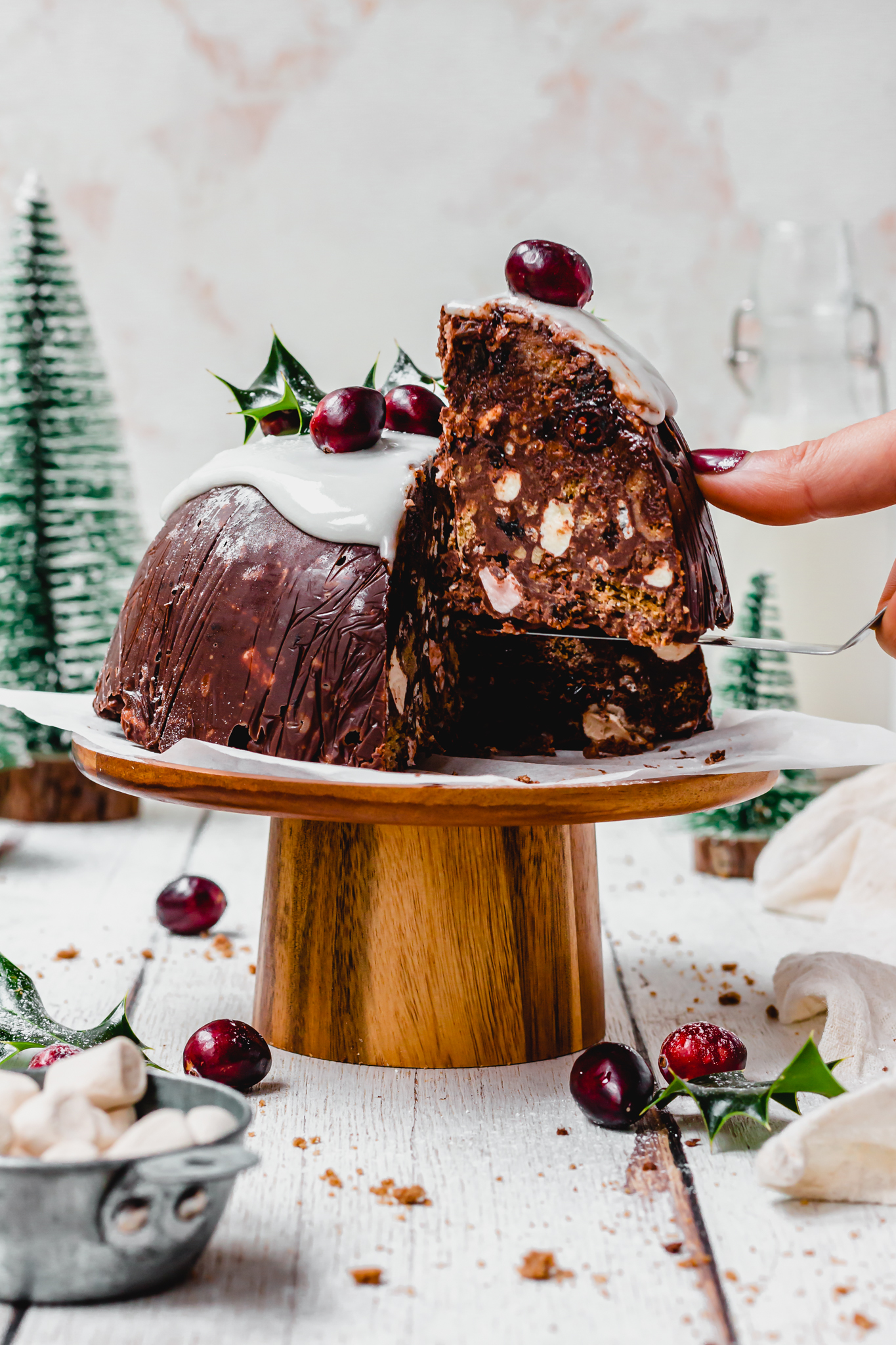 Lifting up a slice of Chocolate Christmas Pudding Bomb